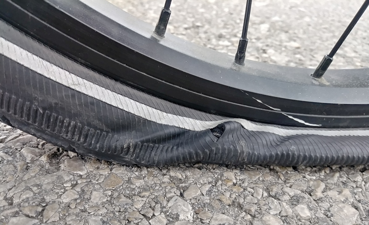 Turns out that it was a crack in the sidewall of the Marathon Plus tire that was abrading the inner tubes.